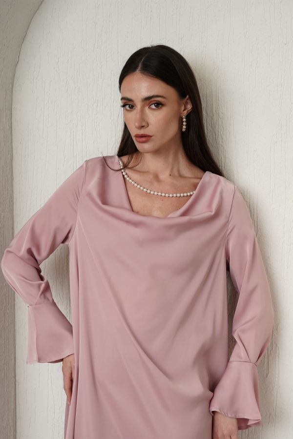 Pink dress with pearl necklace