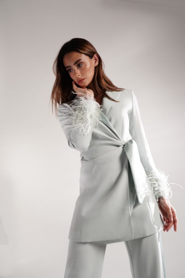 Mint green jacket with feather sleeves