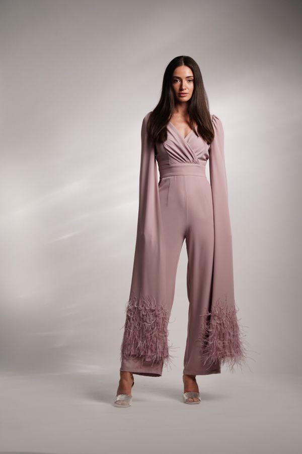 Pink jumpsuit with feather cape sleeves