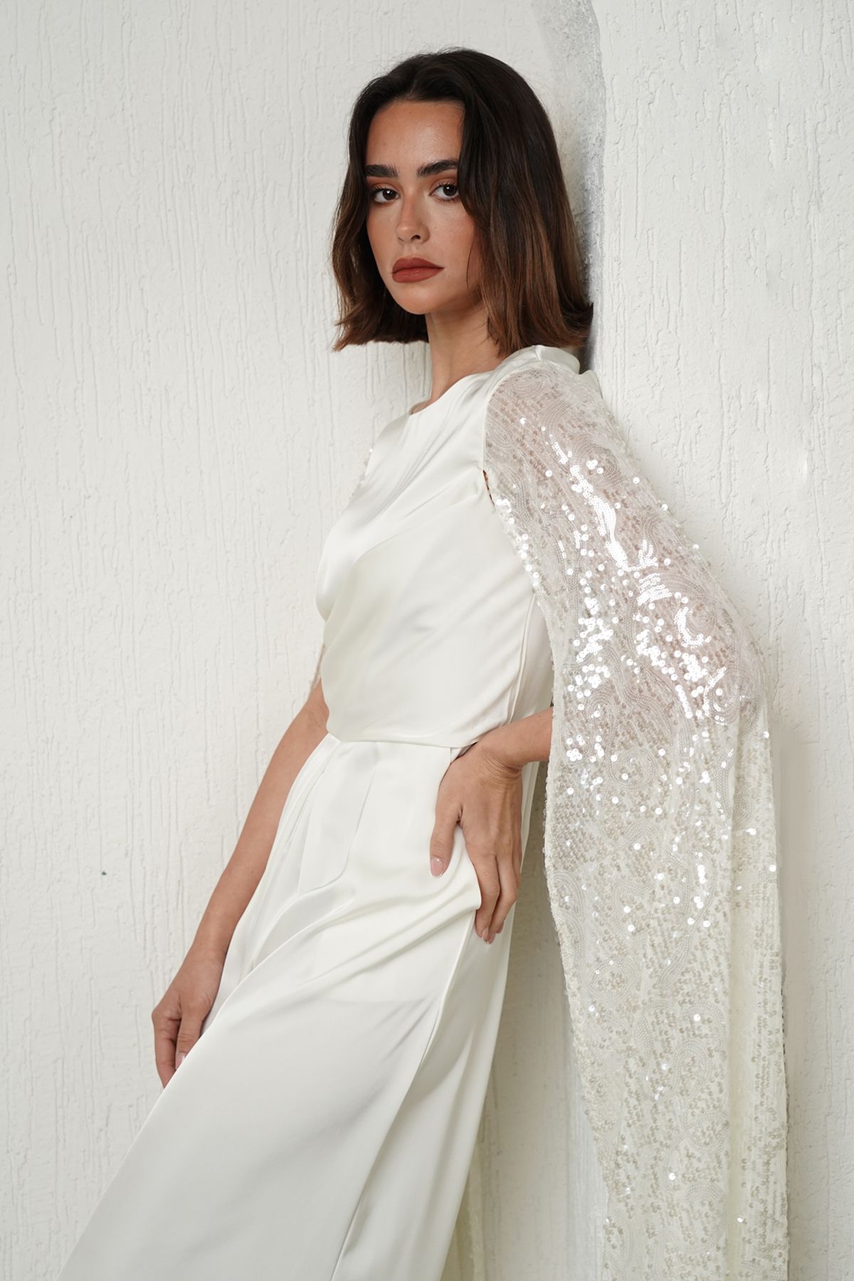 White jumpsuit with cape sleeves top