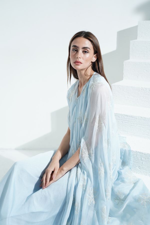 Blue embroidered dress with cape