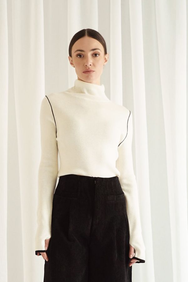 Cream shirt with black outlines